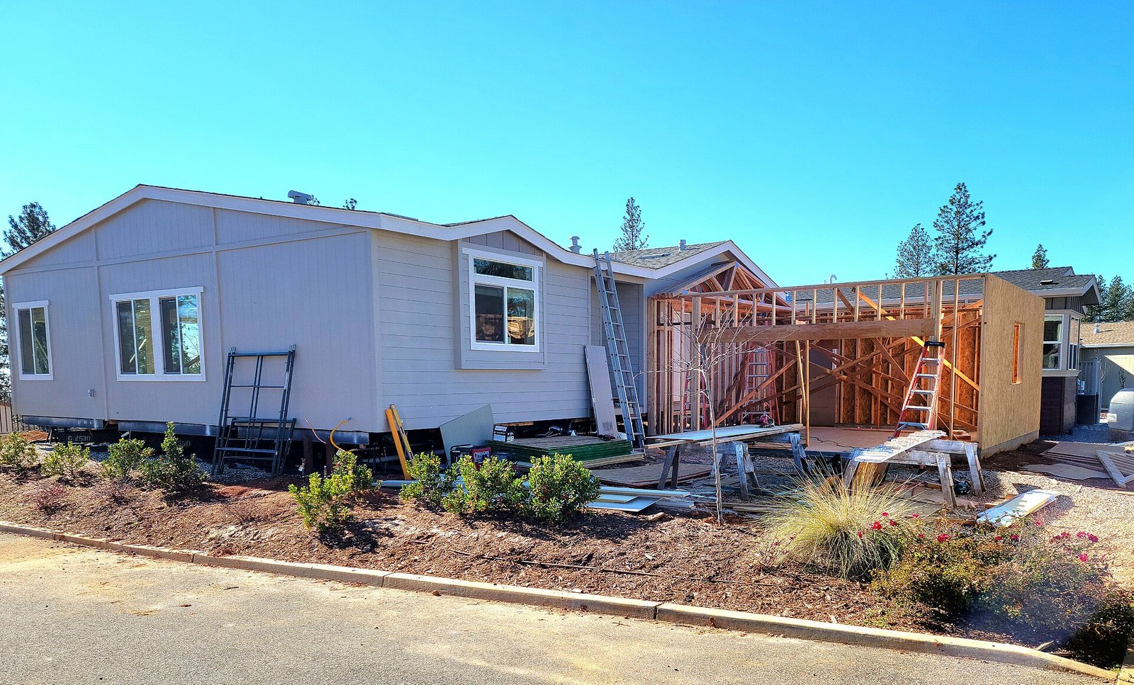 Manufactured home with porch and lawn